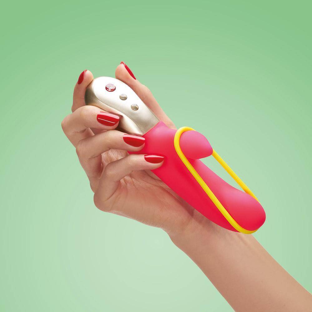 Female hand holding-hot pink Amorino mini-vibe-libia stimulator shown in alternate position