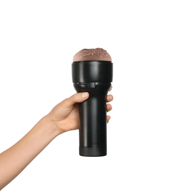 Kiiroo Feel September Stroker shown being held in hand